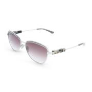 Calvin Klein Stiliga solglasögon för kvinnor med gradientlinser och me...