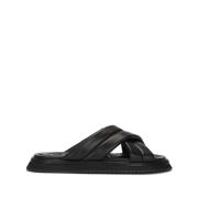 Dolce & Gabbana Svarta platta sandaler i läder med korsad rem Black, H...