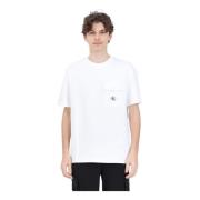 Calvin Klein Jeans Vit T-shirt med strukturerat mönster och logoknapp ...