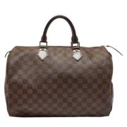 Louis Vuitton Vintage Pre-owned Belagd canvas handvskor Brown, Dam