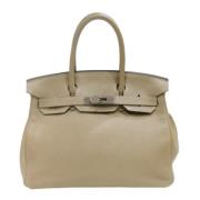 Hermès Vintage Pre-owned Laeder handvskor Beige, Dam