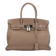 Hermès Vintage Pre-owned Laeder handvskor Beige, Dam