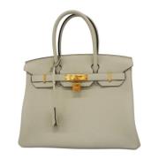 Hermès Vintage Pre-owned Laeder handvskor Beige, Dam