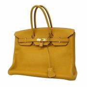 Hermès Vintage Pre-owned Laeder handvskor Yellow, Dam