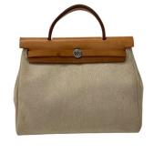 Hermès Vintage Pre-owned Canvas handvskor Beige, Dam